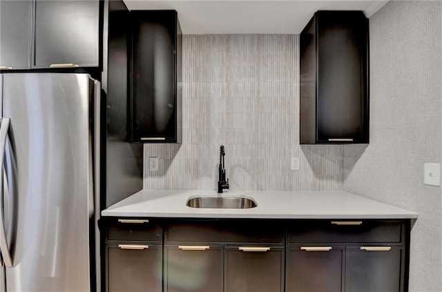 kitchen with sink and stainless steel refrigerator