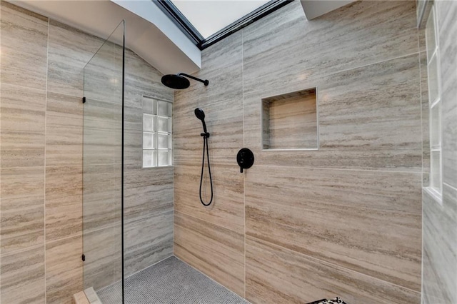 bathroom with a tile shower