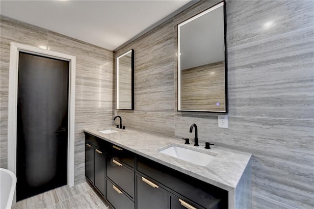 bathroom with vanity, tile walls, and decorative backsplash