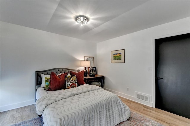 bedroom with wood-type flooring