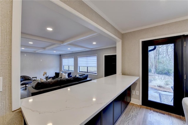 kitchen featuring beam ceiling, coffered ceiling, light hardwood / wood-style floors, light stone countertops, and kitchen peninsula