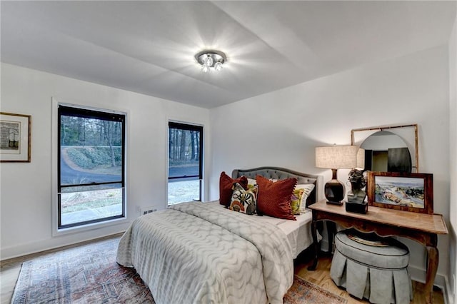 bedroom with light hardwood / wood-style flooring