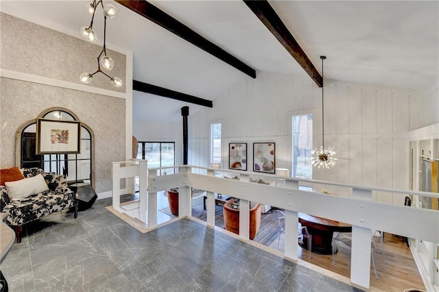 interior space with beam ceiling and high vaulted ceiling