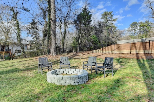 view of yard with a fire pit