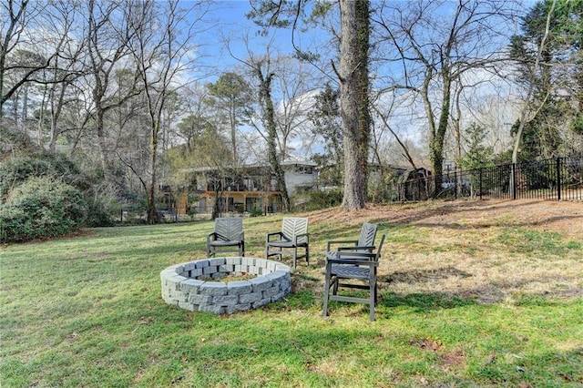 view of yard featuring an outdoor fire pit