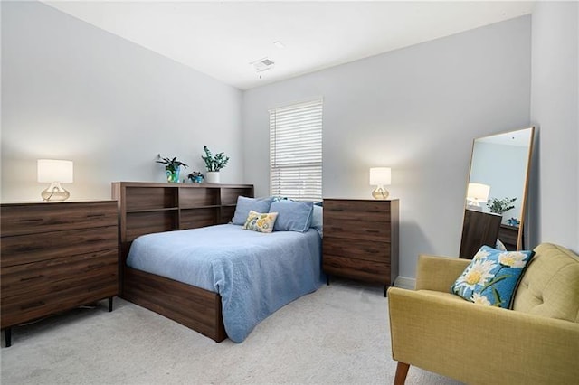 bedroom featuring light carpet