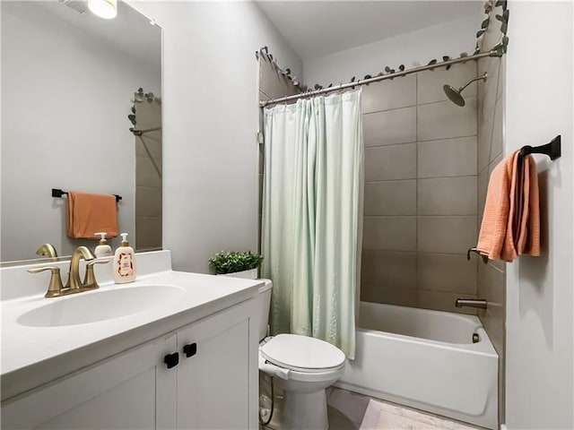 full bathroom with vanity, toilet, and shower / bath combo with shower curtain