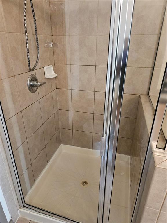 bathroom with a stall shower
