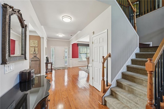 852 Van Briggle Path, Sugar Hill, GA 30518 - foyer with light wood-style flooring, stairs, crown molding, and wainscoting