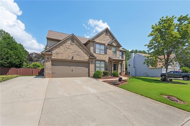 852 Van Briggle Path, Sugar Hill, GA 30518 - view of front facade with brick siding, driveway, and a garage