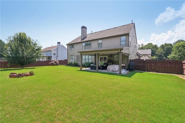852 Van Briggle Path, Sugar Hill, GA 30518 - back of house featuring a patio, a fenced backyard, a chimney, and a gate