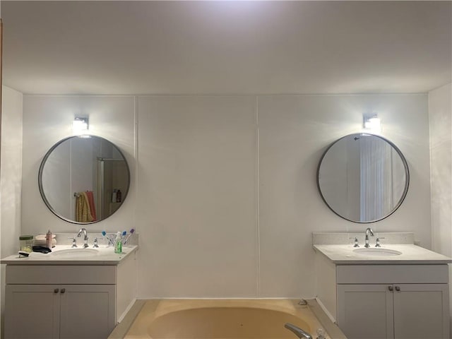 bathroom featuring vanity and a bathtub