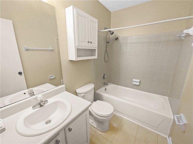 full bathroom with tile patterned floors, toilet, tiled shower / bath combo, and vanity