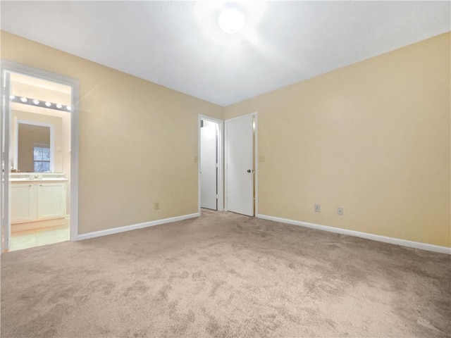 spare room with light carpet