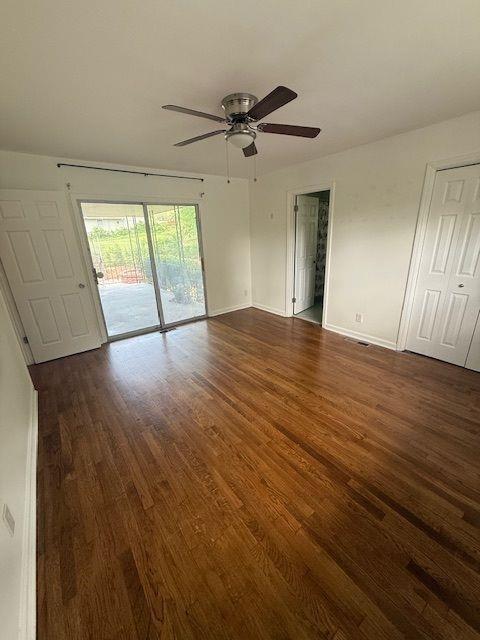 2190 Olive Springs Rd SE, Marietta, GA 30060 - spare room featuring dark wood finished floors, ceiling fan, and baseboards