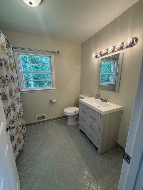 2190 Olive Springs Rd SE, Marietta, GA 30060 - bathroom with toilet, vanity, and tile patterned flooring