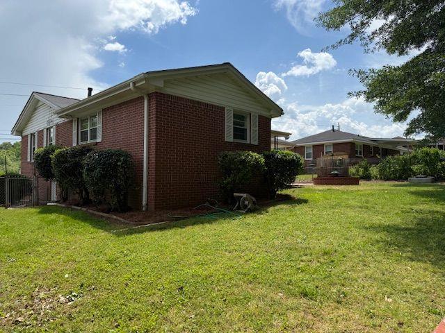 2190 Olive Springs Rd SE, Marietta, GA 30060 - view of side of home featuring brick siding and cooling unit