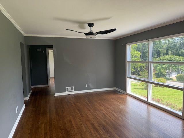 2190 Olive Springs Rd SE, Marietta, GA 30060 - empty room featuring wood finished floors, ornamental molding, ceiling fan, and baseboards