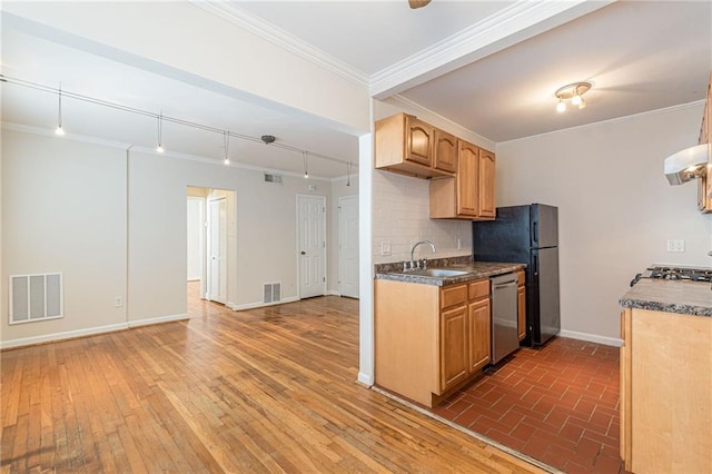 kitchen with dishwasher, sink, dark hardwood / wood-style floors, backsplash, and crown molding