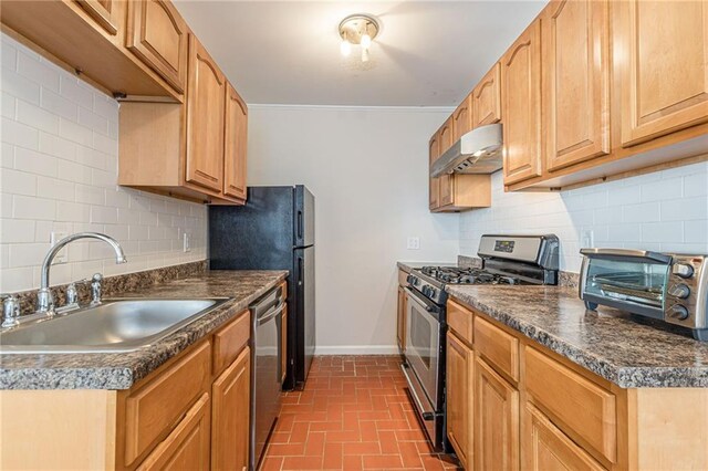 kitchen with decorative backsplash, stainless steel appliances, and sink