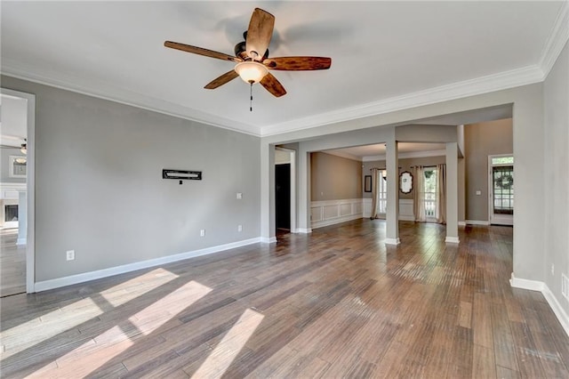 4770 Spring Park Cir, Suwanee, GA 30024 - unfurnished living room featuring ceiling fan, ornamental molding, and dark wood-style floors