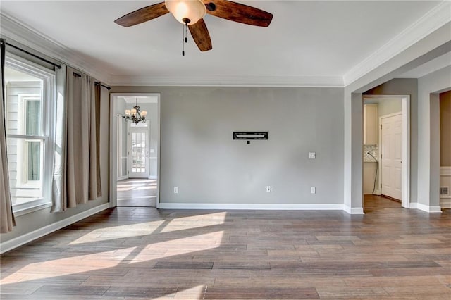4770 Spring Park Cir, Suwanee, GA 30024 - spare room featuring a chandelier, ceiling fan, wood finished floors, and crown molding