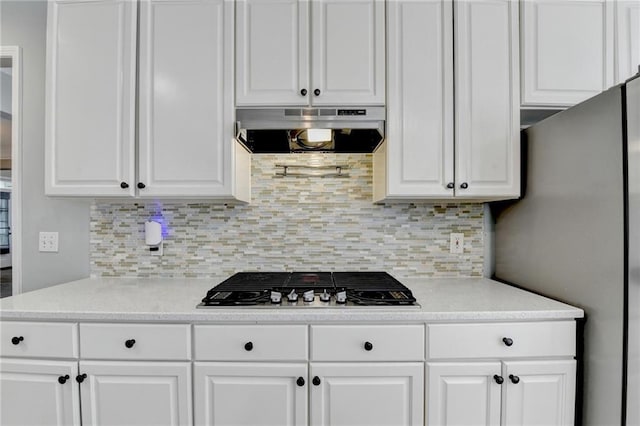 4770 Spring Park Cir, Suwanee, GA 30024 - kitchen featuring exhaust hood, appliances with stainless steel finishes, white cabinets, and backsplash