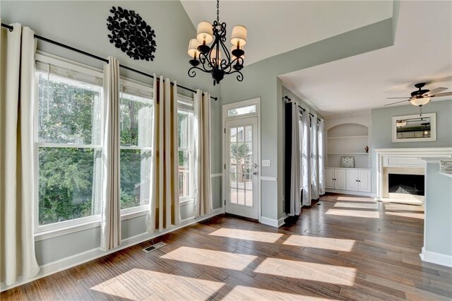 4770 Spring Park Cir, Suwanee, GA 30024 - unfurnished dining area featuring hardwood / wood-style floors, built in features, plenty of natural light, and ceiling fan
