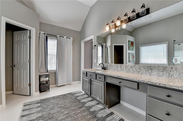 4770 Spring Park Cir, Suwanee, GA 30024 - bathroom with vaulted ceiling, tile patterned floors, vanity, and a shower