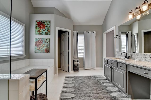 4770 Spring Park Cir, Suwanee, GA 30024 - bathroom with plenty of natural light, vanity, lofted ceiling, tile patterned floors, and a shower