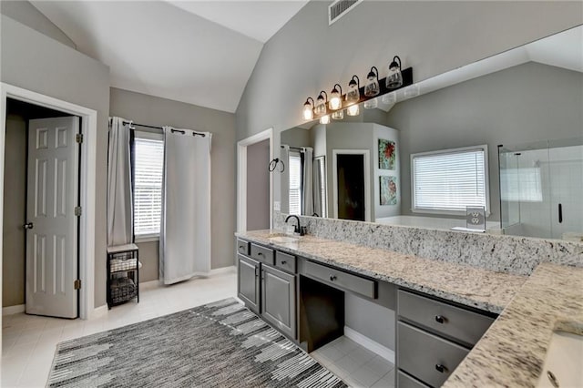 4770 Spring Park Cir, Suwanee, GA 30024 - bathroom with vaulted ceiling, tile patterned floors, a stall shower, vanity, and a bath