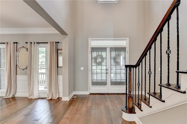 4770 Spring Park Cir, Suwanee, GA 30024 - entrance foyer featuring french doors, wood finished floors, stairway, and crown molding