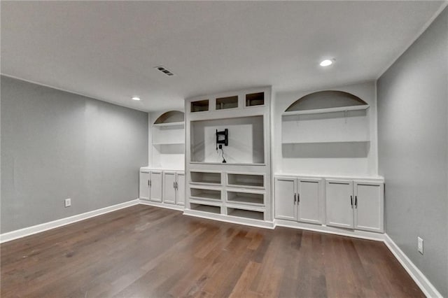 4770 Spring Park Cir, Suwanee, GA 30024 - unfurnished living room with dark wood-style flooring, built in features, and recessed lighting