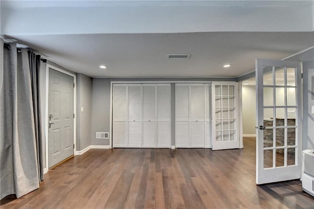 4770 Spring Park Cir, Suwanee, GA 30024 - unfurnished bedroom with wood finished floors, french doors, and recessed lighting