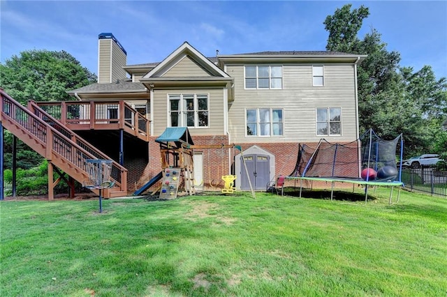 4770 Spring Park Cir, Suwanee, GA 30024 - back of house with a trampoline, a chimney, a deck, stairs, and brick siding