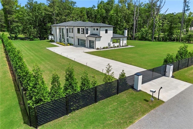 2940 Old Peachtree Rd, Dacula, GA 30019 - contemporary home featuring concrete driveway, a garage, stucco siding, and a chimney