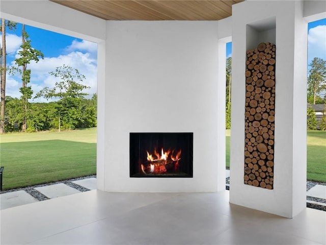 2940 Old Peachtree Rd, Dacula, GA 30019 - detailed view of finished concrete floors and a warm lit fireplace