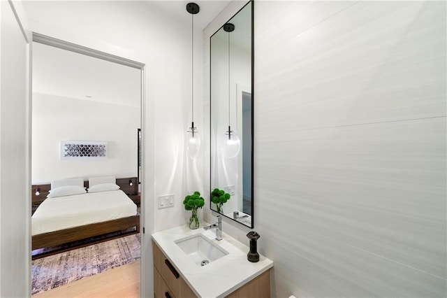 2940 Old Peachtree Rd, Dacula, GA 30019 - ensuite bathroom featuring vanity and wood finished floors