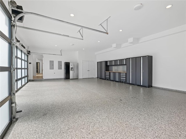 2940 Old Peachtree Rd, Dacula, GA 30019 - garage featuring electric panel, recessed lighting, and baseboards