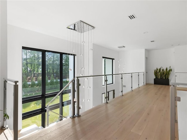 2940 Old Peachtree Rd, Dacula, GA 30019 - corridor featuring an upstairs landing and wood finished floors