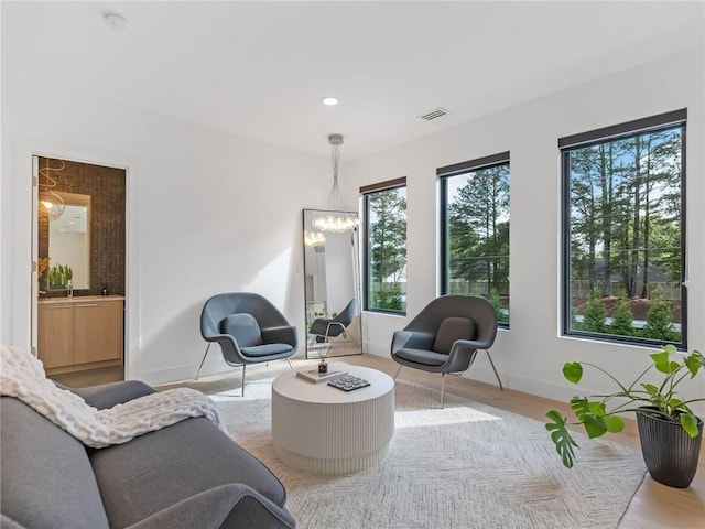 2940 Old Peachtree Rd, Dacula, GA 30019 - living area featuring a chandelier, baseboards, recessed lighting, and wood finished floors