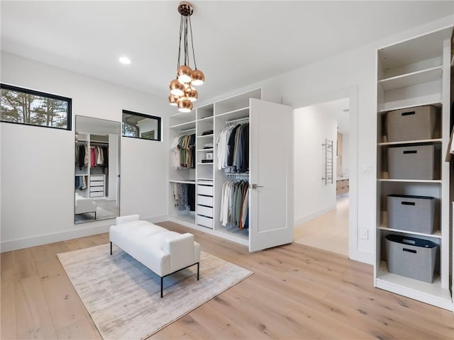2940 Old Peachtree Rd, Dacula, GA 30019 - living area with wood finished floors, a chandelier, baseboards, and recessed lighting