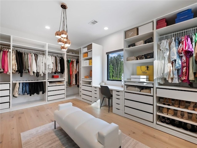 2940 Old Peachtree Rd, Dacula, GA 30019 - spacious closet with wood finished floors and built in study area