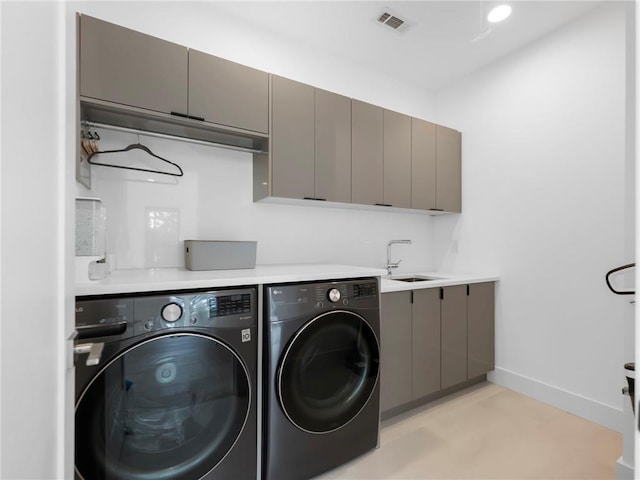 2940 Old Peachtree Rd, Dacula, GA 30019 - clothes washing area with washing machine and clothes dryer, cabinet space, and baseboards
