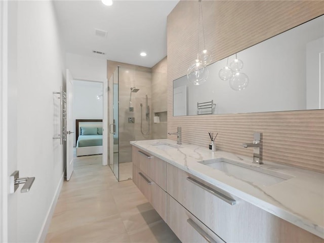 2940 Old Peachtree Rd, Dacula, GA 30019 - full bathroom with a shower stall, tasteful backsplash, double vanity, baseboards, and recessed lighting