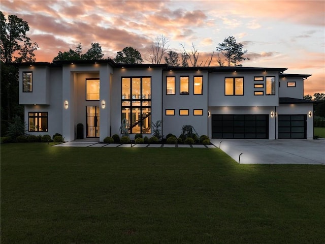 2940 Old Peachtree Rd, Dacula, GA 30019 - contemporary home with stucco siding, a garage, driveway, and a front yard