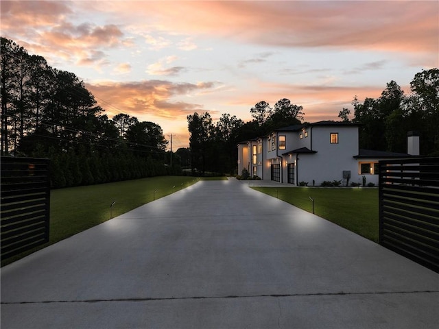 2940 Old Peachtree Rd, Dacula, GA 30019 - view of front of property with driveway, an attached garage, and a lawn