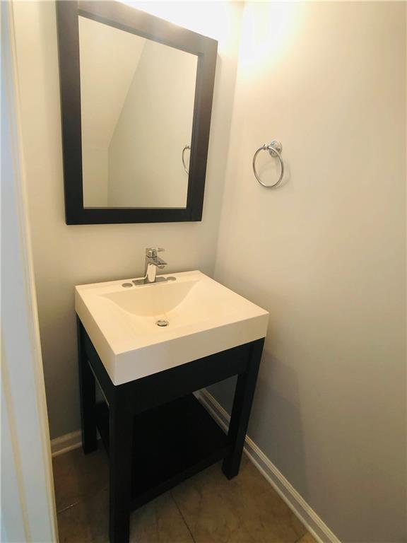 4645 Valais Ct Unit 10, Johns Creek, GA 30022 - bathroom with vanity and tile patterned floors