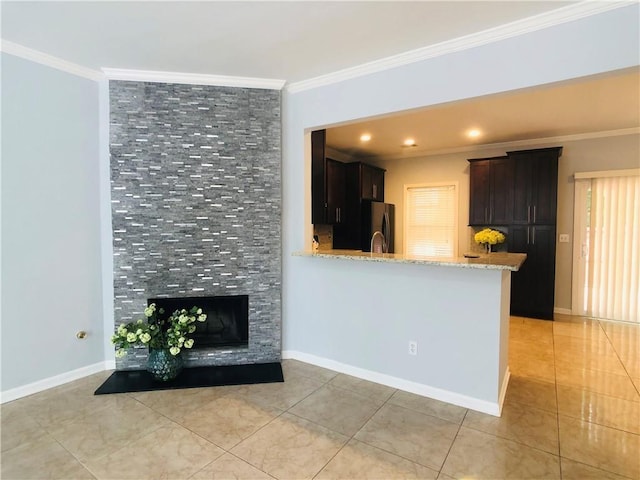 4645 Valais Ct Unit 10, Johns Creek, GA 30022 - unfurnished living room with crown molding, light tile patterned floors, and a tiled fireplace