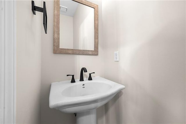 bathroom featuring a sink and visible vents